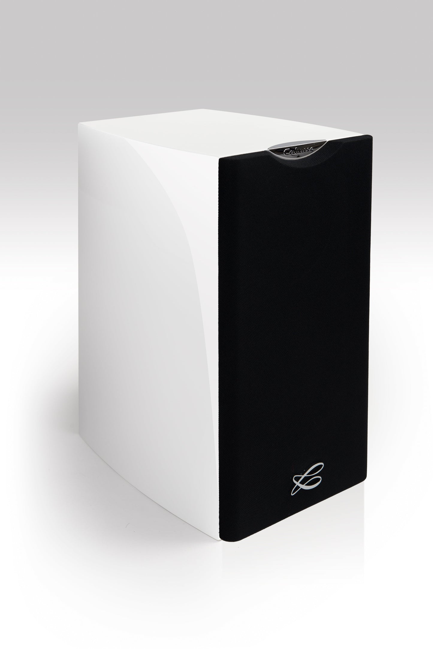 The Cabasse MINORCA MC40 Bookshelf Speakers by Cabasse are sleek, rectangular, ultra-compact 3-way speakers in glossy white with a black front grille and silver logo at the bottom, shown on a plain white background.