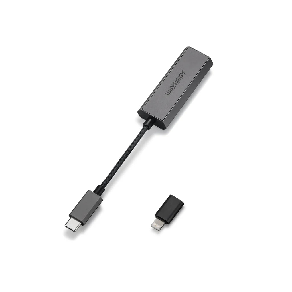 The Astell & Kern HC2 Portable DAC and Headphone Amp - Open Box is displayed with a black USB-C to Ethernet adapter and a detachable USB-C to Lightning adapter—perfect for high-resolution sound with your devices on a white background.