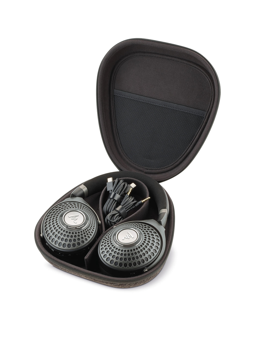 A shot of the Focal Bathys wireless noise-cancelling headphones box contents showing an open rigid carrying case holding the headphones and some cables. 