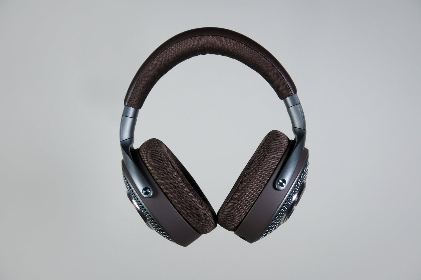 The Focal Hadenys headphones by Focal feature brown cushioned ear pads and headband, metallic accents, and aluminium/magnesium speaker drivers, shown against a plain light gray background.