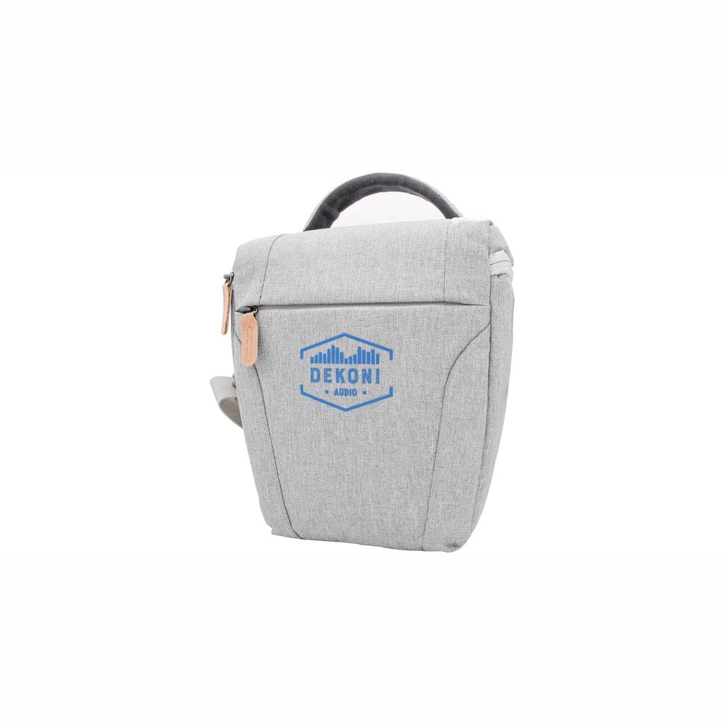 The Dekoni Audio Headphone Savior Universal Carrying Case - Clearance is a light gray fabric bag with a handle, leather zipper pull, and blue Dekoni Audio logo on the front, shown against a white background.