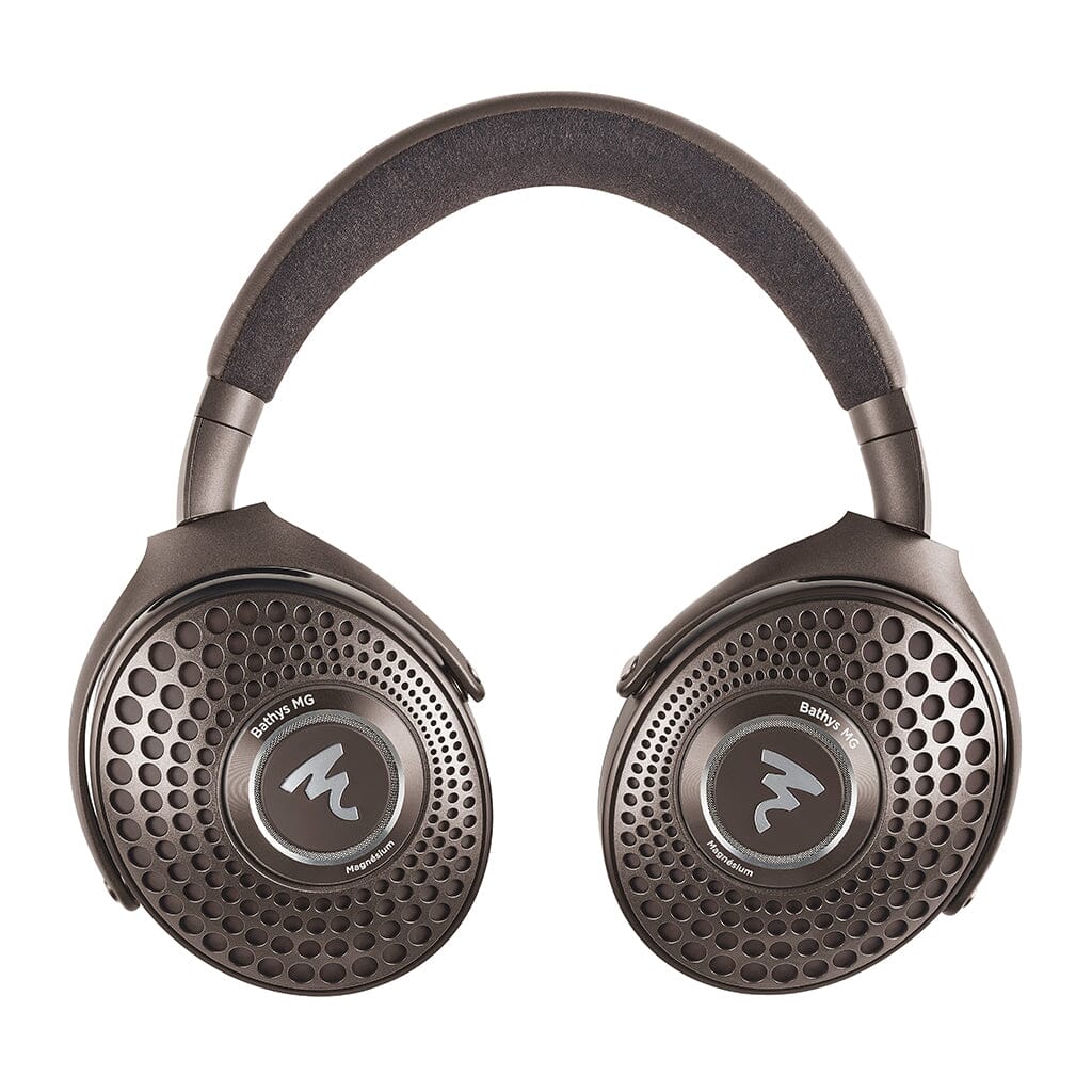 The Focal Bathys MG Wireless Headphones by Focal feature an open-back, over-ear design with metallic perforated ear cups, a padded headband, and the Focal logo on each cup—blending premium style and superior sound.