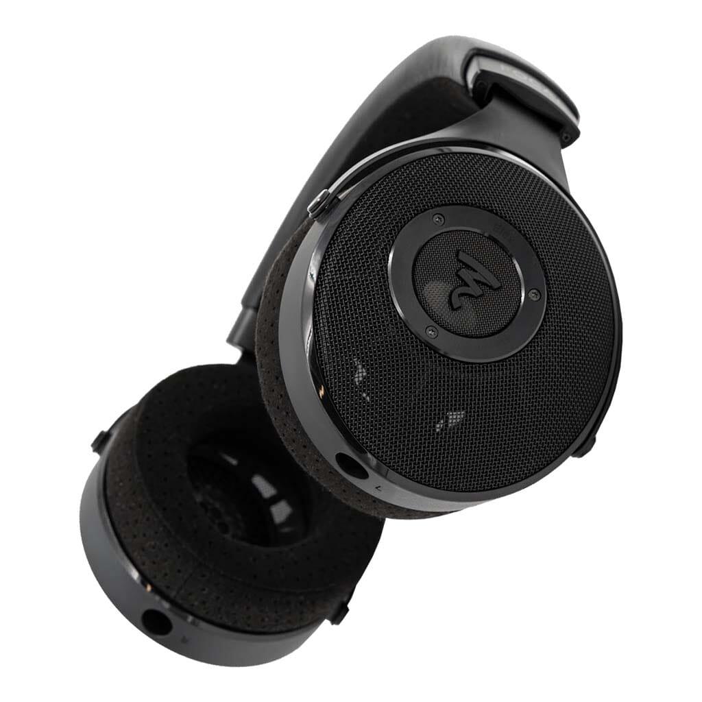 The Focal Elex Headphones by Focal are black over-ear dynamic headphones with a perforated headband and mesh-covered earcups, featuring a circular logo—engineered for sonic perfection inspired by the acclaimed Elex series.