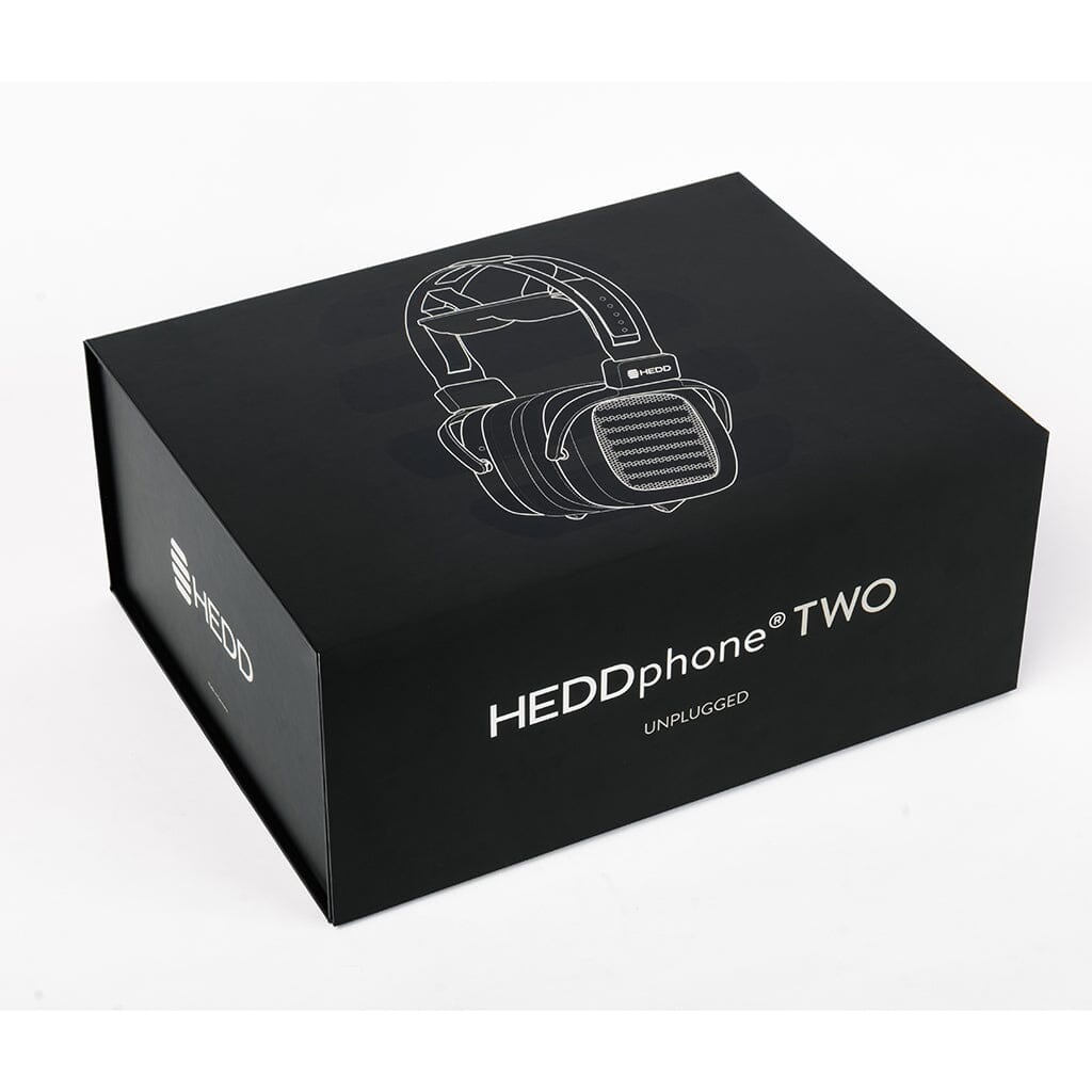 A black box with a white headphone outline and HEDD Audio HEDDphone TWO UNPLUGGED Edition branding highlights this reference headphone, which features advanced Air Motion Transformer (AMT) driver technology.