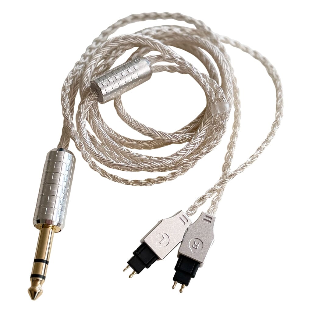 The Listenmore Etched Headphone Cable for Sennheiser HD 600 Series is a coiled silver upgrade cable featuring a 1/4 inch (6.35mm) stereo plug on one end and two labeled L and R connectors, shown against a white background.