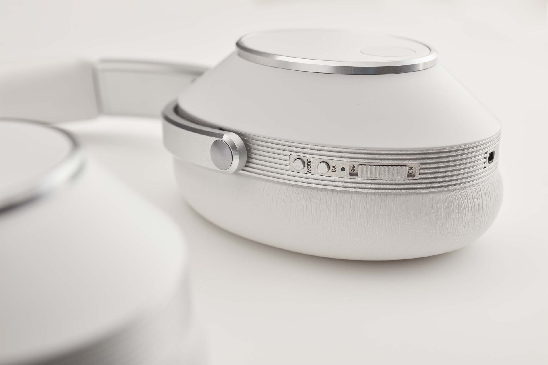 t+a solitaire t wireless headphones in white buttons