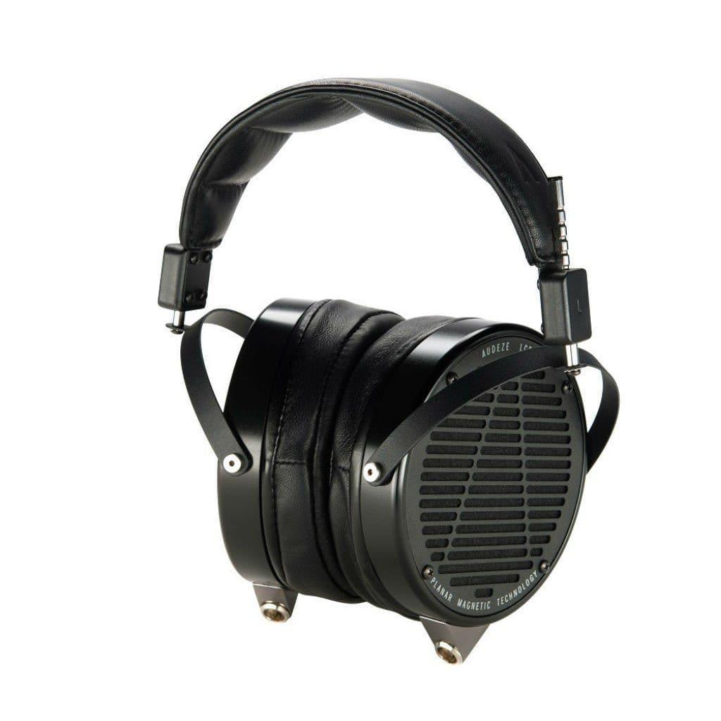 The Audeze LCD-X 2024 Creators Edition Open Box by Audeze features black planar magnetic drivers, a padded headband, and large circular ear cups with a grille design and metal accents—ideal for high-performance audio and pro mixing.