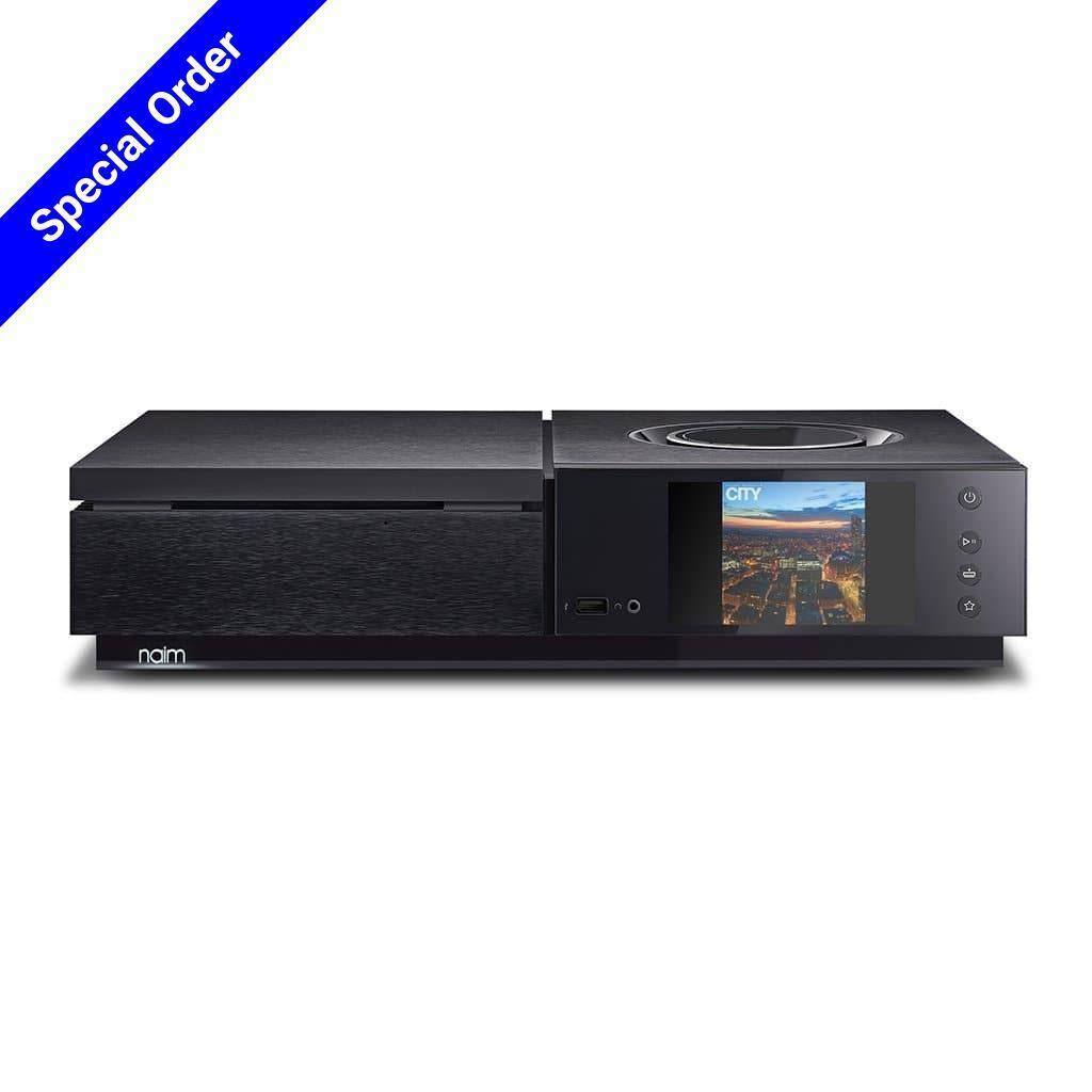 A black Naim UNITI STAR music player with Chromecast built-in, featuring a display screen of a city at sunset and a blue Special Order banner in the top left corner.