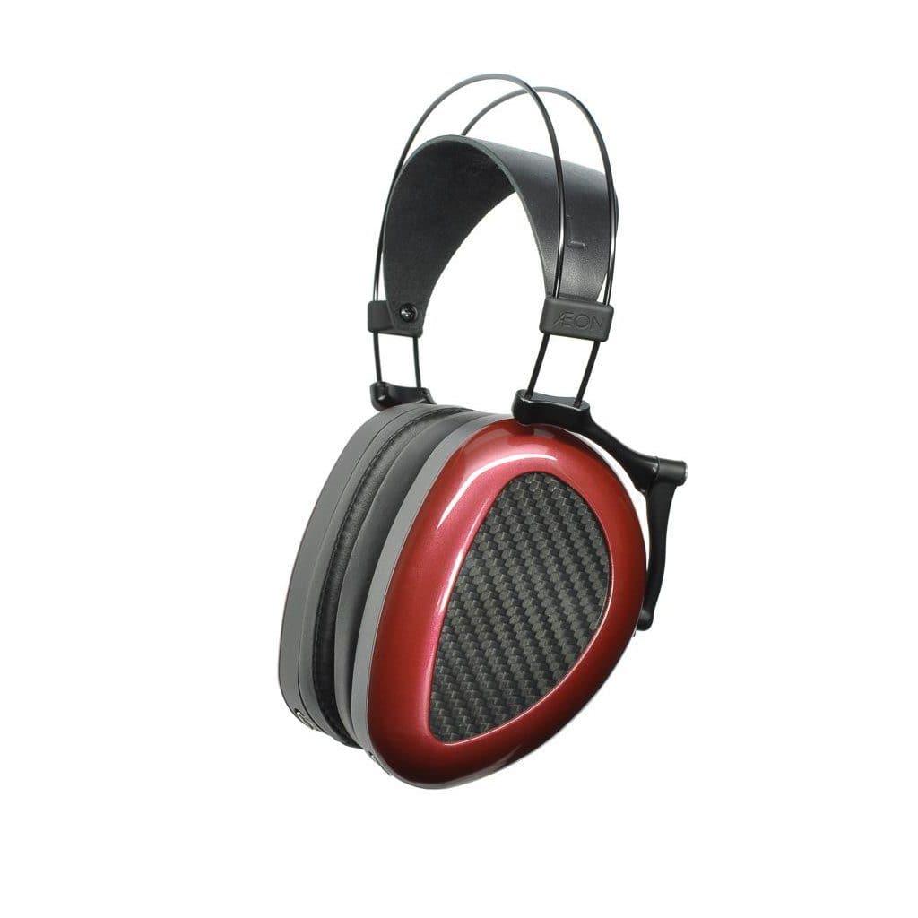 The Dan Clark Audio AEON 2 Closed Headphones feature a red and black carbon fiber design, padded headband, and large oval ear cups—ideal portable closed-back headphones for immersive listening.