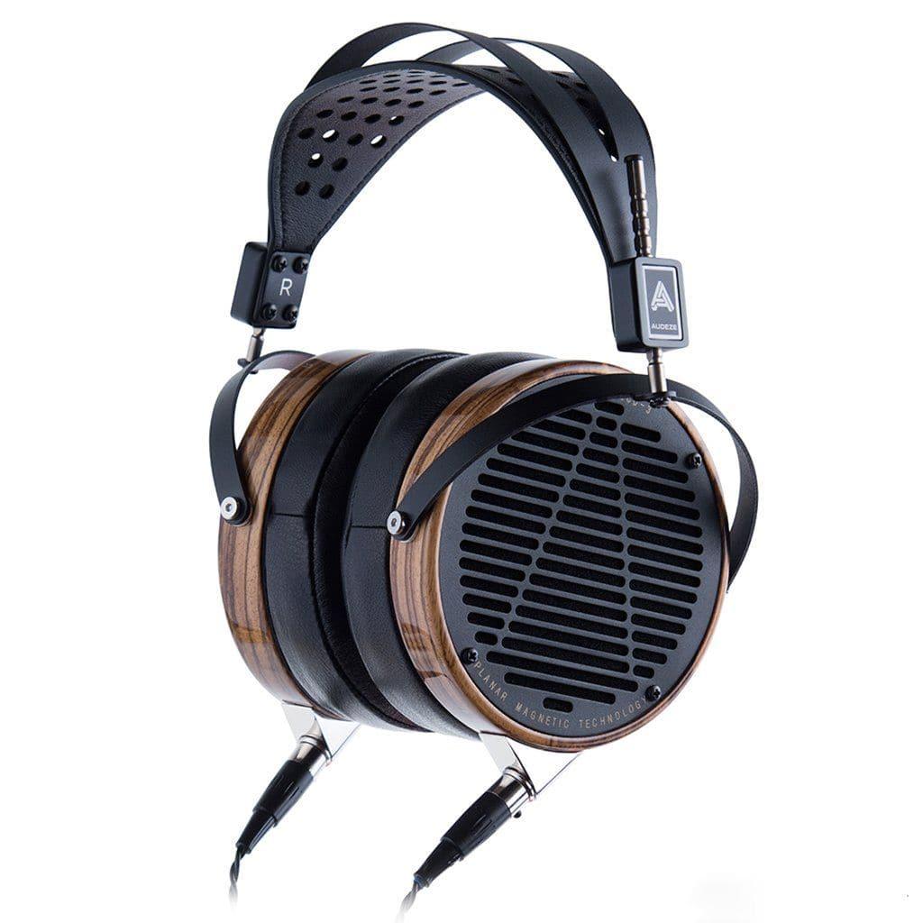 The Audeze LCD-3 headphones feature over-ear planar magnetic drivers, wooden ear cups, black metal grilles, and a wide padded headband. Dual cables enhance Hi-Fi listening while their premium Audeze design ensures modern style and comfort.