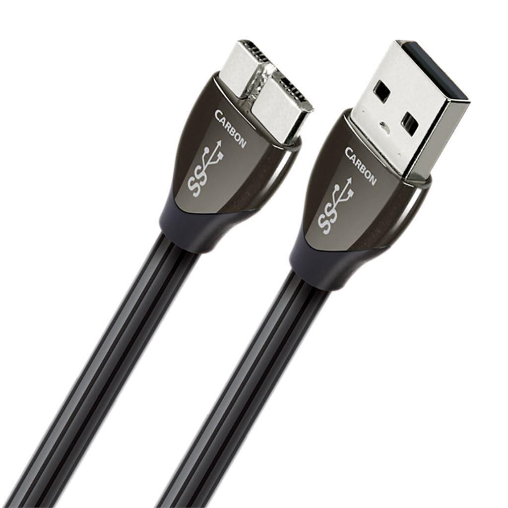 Close-up of the AudioQuest Carbon USB Digital Interconnect by AudioQuest, a black USB 3.0 cable with one standard USB-A and one USB-B connector labeled “SS” and “Carbon,” designed for USB audio and featuring High-Density Polyethylene Insulation.