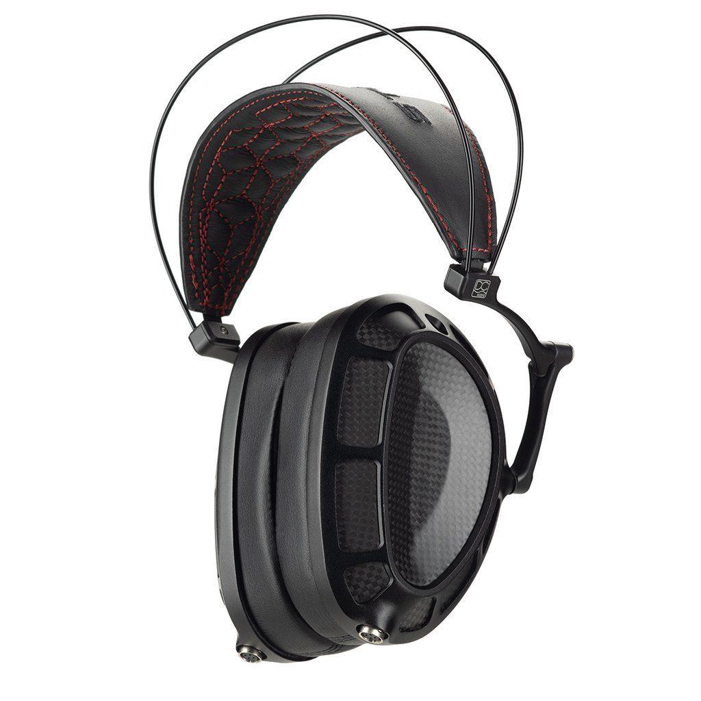 A pair of Dan Clark Audio Stealth Headphones - Open Box with large black ear cups, carbon fiber pattern, and a padded headband with red stitching and adjustable suspension.
