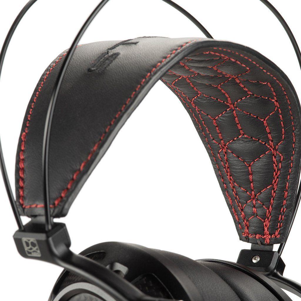 Close-up of the Dan Clark Audio Stealth Headphones - Open Box headband, showing detailed red geometric stitching on padded leather and a double-wire frame—demonstrating the craftsmanship behind these planar magnetic headphones.