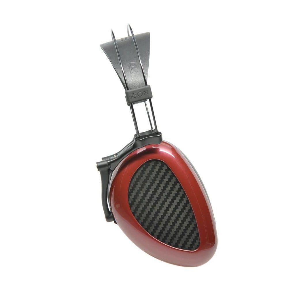 A single Dan Clark Audio AEON 2 Closed over-ear headphone with a metallic red ear cup, carbon fiber inner panel, and black headband labeled AEON and R for right side—premium closed-back headphones by Dan Clark Audio on white background.