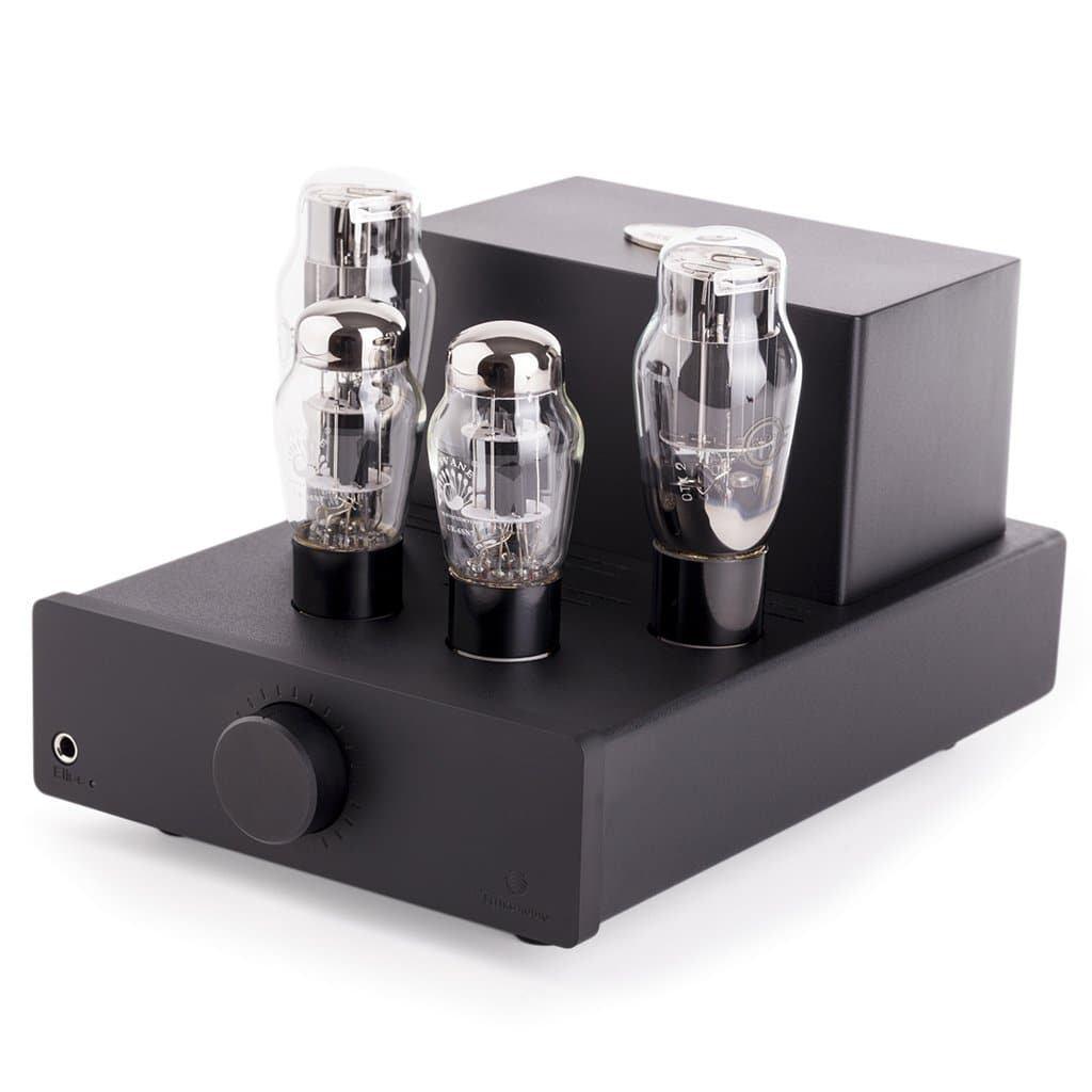 The Feliks Audio Elise MK II by Feliks Audio is a modern, minimalistic OTL headphone amplifier with four exposed vacuum tubes, a large control knob, and a front headphone jack—functioning as both amplifier and preamplifier for pristine audio.