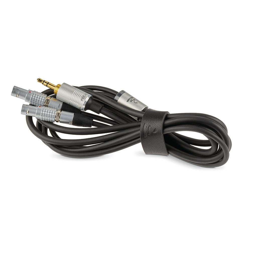 The Focal Utopia 2022 features a coiled black audio cable with a 3.5mm gold-plated jack and three silver multi-pin connectors, secured by a black Velcro strap, delivering premium sound for flagship headphones.