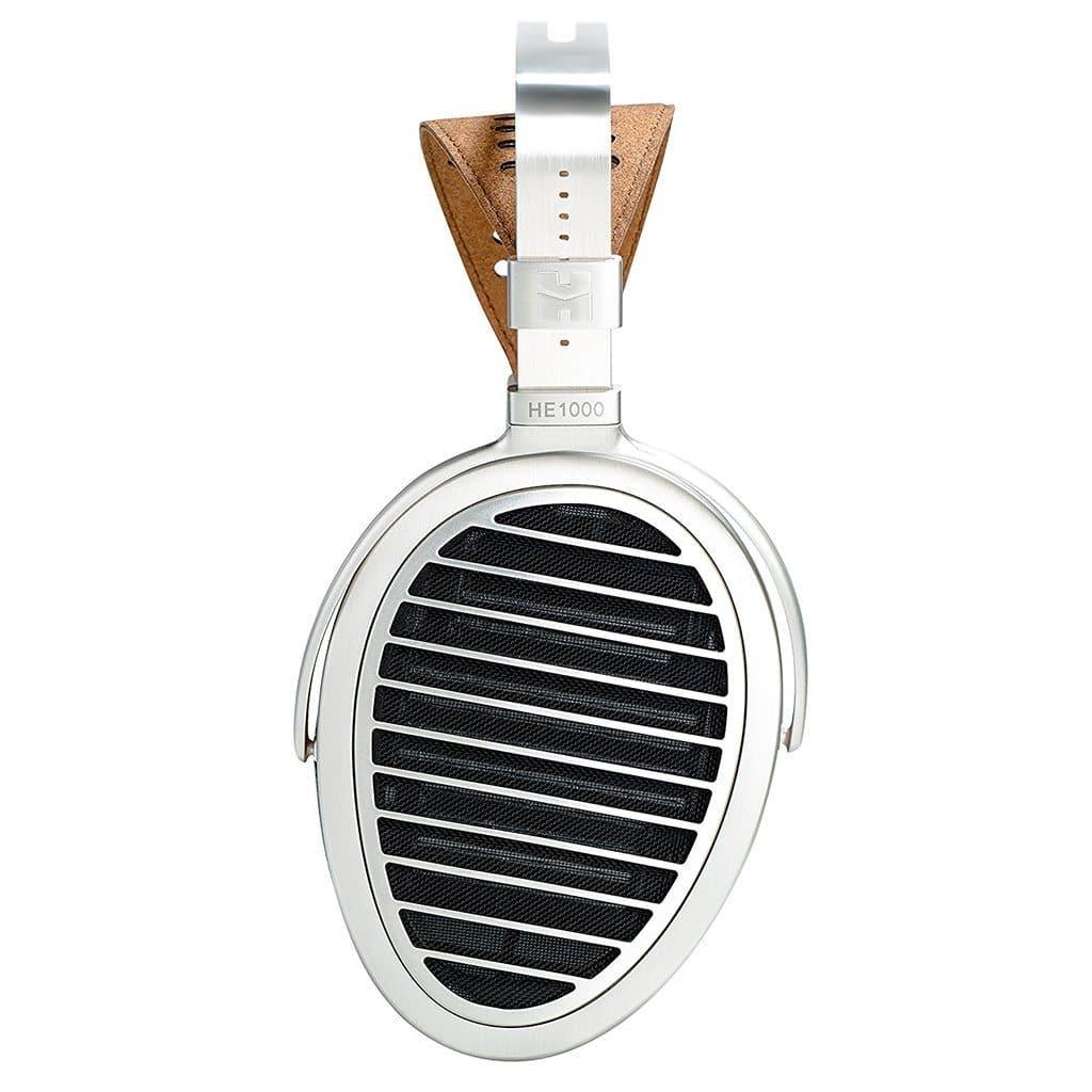 A close-up of the Hifiman HE1000 V4 Headphones - Stealth Magnet Edition shows its oval ear cup with silver grill, black mesh interior, and a brown-padded headband, highlighting Hifiman’s open-back planar magnetic design.