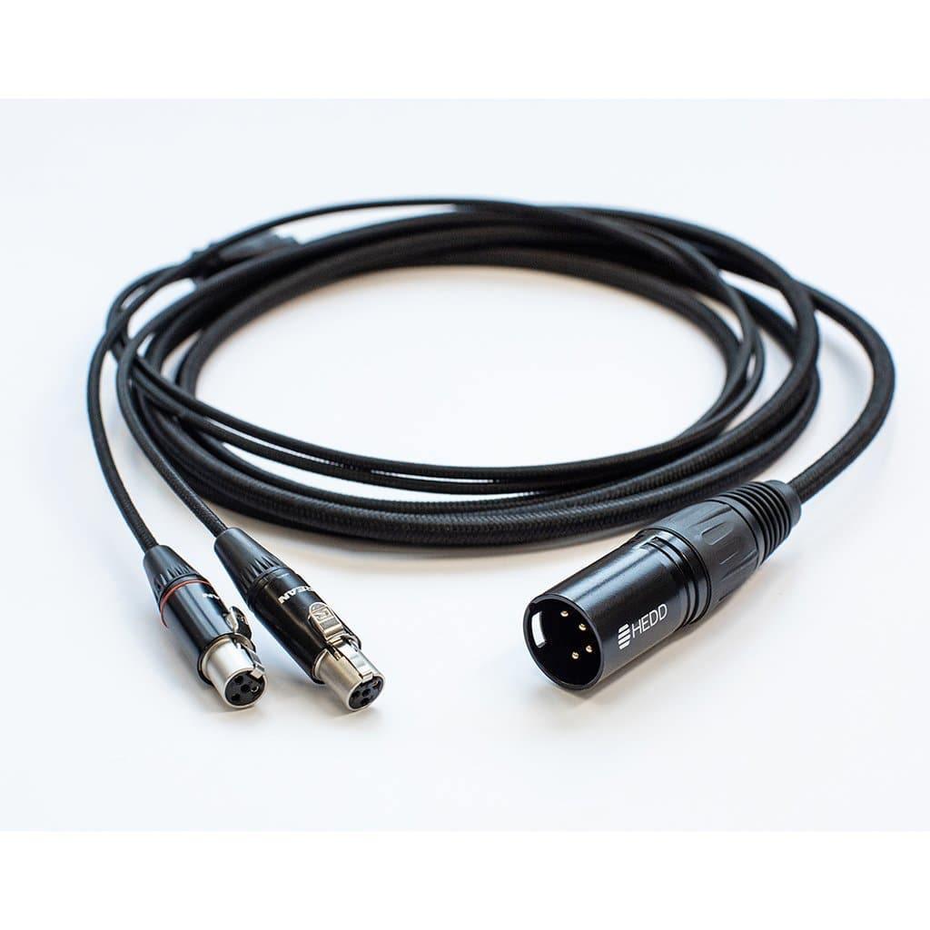 The HEDD Audio HEDDphone Balanced 4-Pin XLR Cable, coiled on a white surface, features a single 4-pin XLR connector for easy connection of your HEDDphone to a headphone amplifier.