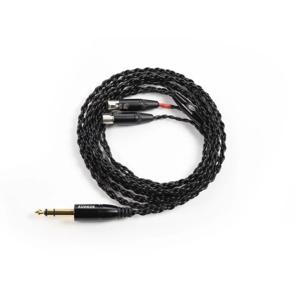 A coiled black braided audio cable from the Audeze LCD-X Headphones | Premium Package features a gold-plated 1/4 stereo plug and dual XLR connectors, designed for planar magnetic headphones by Audeze, shown on a white background.