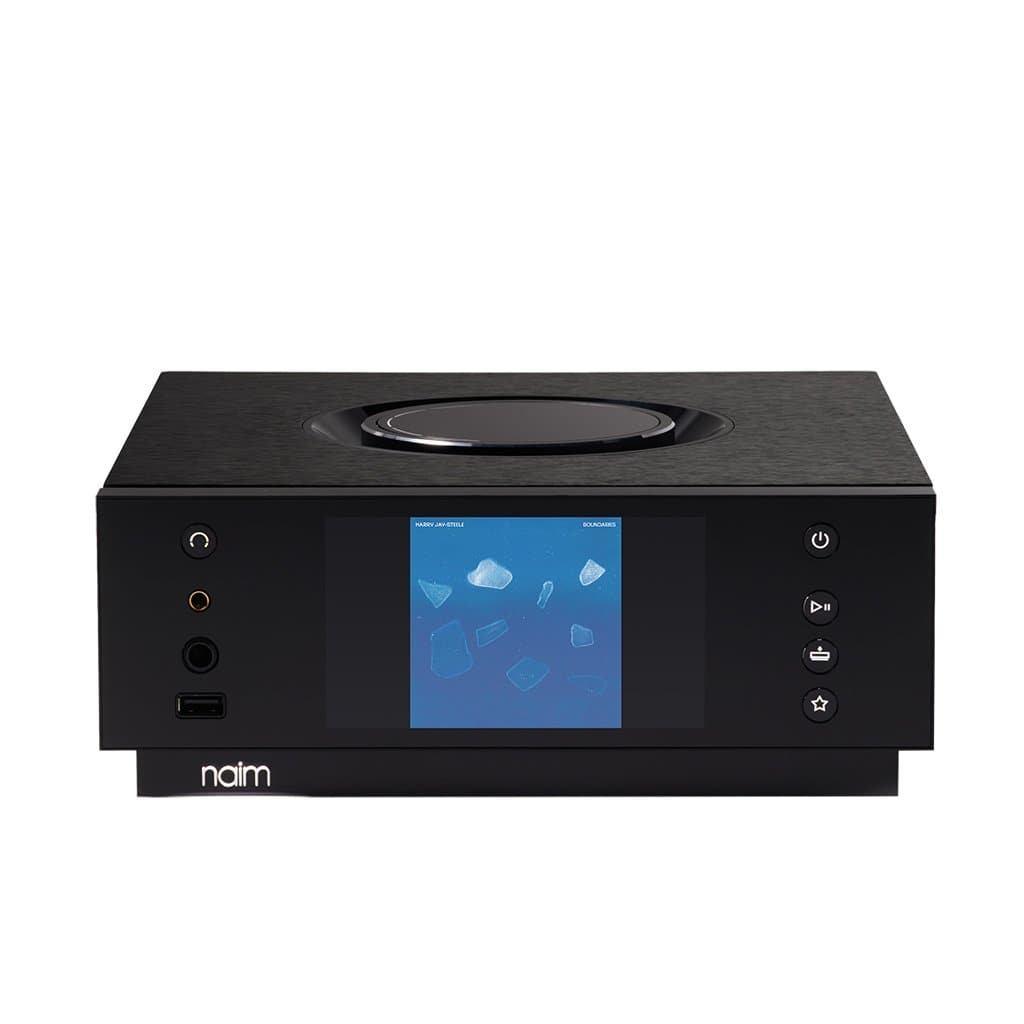 The Naim Uniti Atom Headphone Edition - Open-Box is a premium black music streamer and headphone amplifier with a color display showing album art and control buttons, including play, pause, and volume, all in one sleek device.