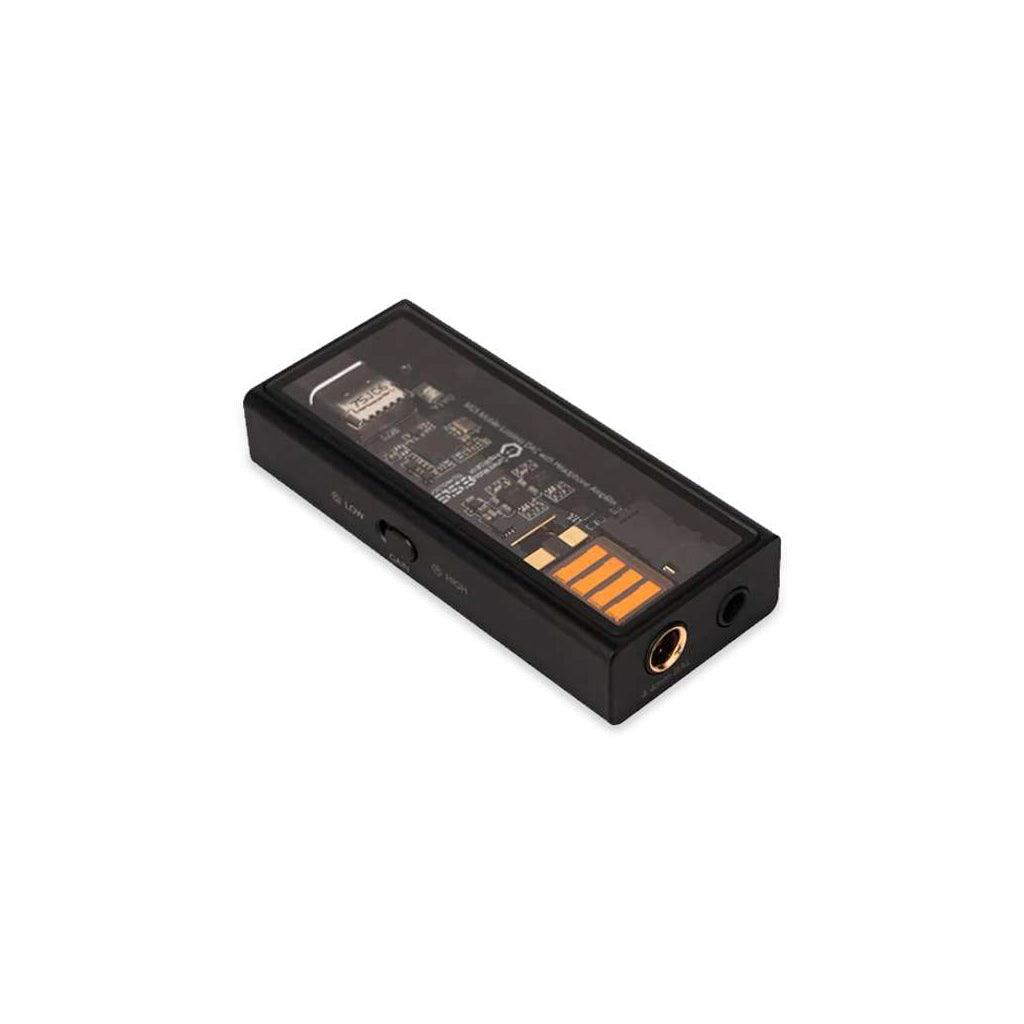 The Questyle M15 USB Portable DAC & Headphone Amplifier (Open Box) by Questyle features a transparent top showing its circuitry, USB connector, headphone jack, and side button—ideal for portable hi-res audio anywhere.