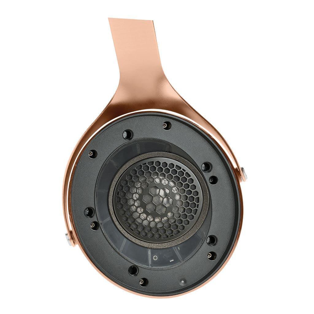 Close-up of a Focal Stellia headphone earcup, showcasing its bronze finish, black honeycomb speaker grill, and advanced beryllium dome driver for outstanding sound isolation.