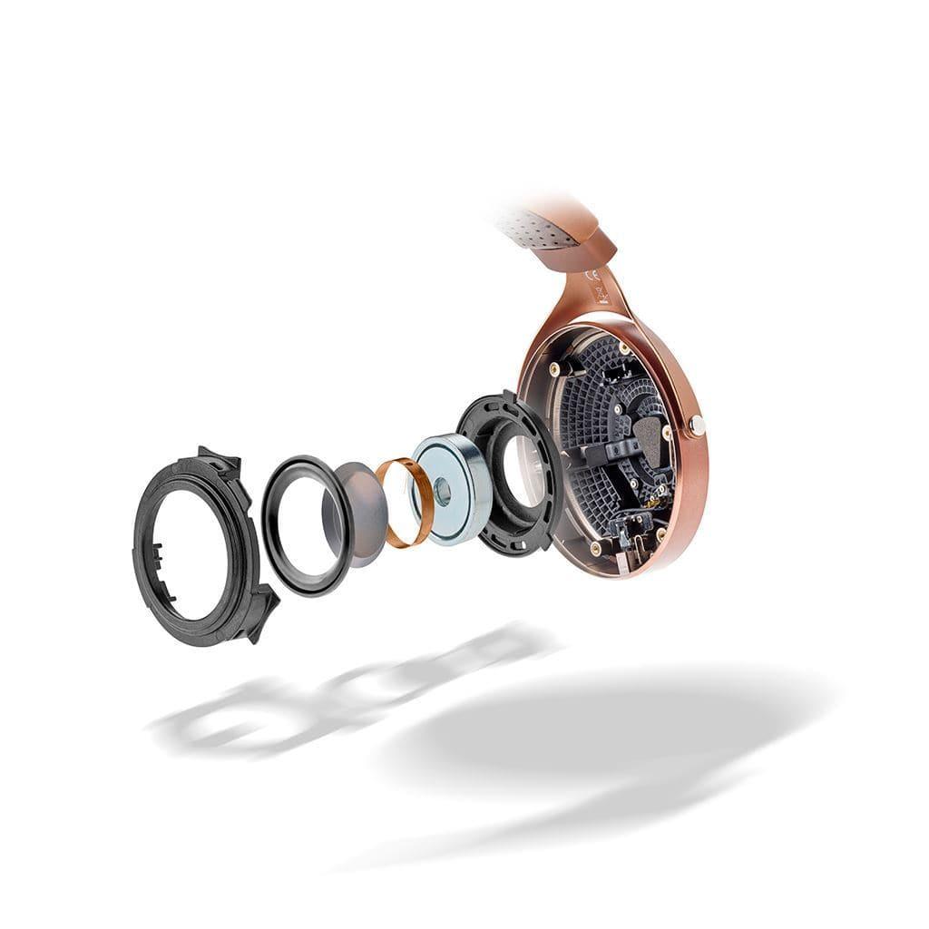 Exploded view of a smartwatch with case, sensors, battery, and circuit board separated for assembly. The rose gold casing and perforated strap are inspired by Focal Stellia Headphones - Open Box from Focal, known for premium sound isolation.