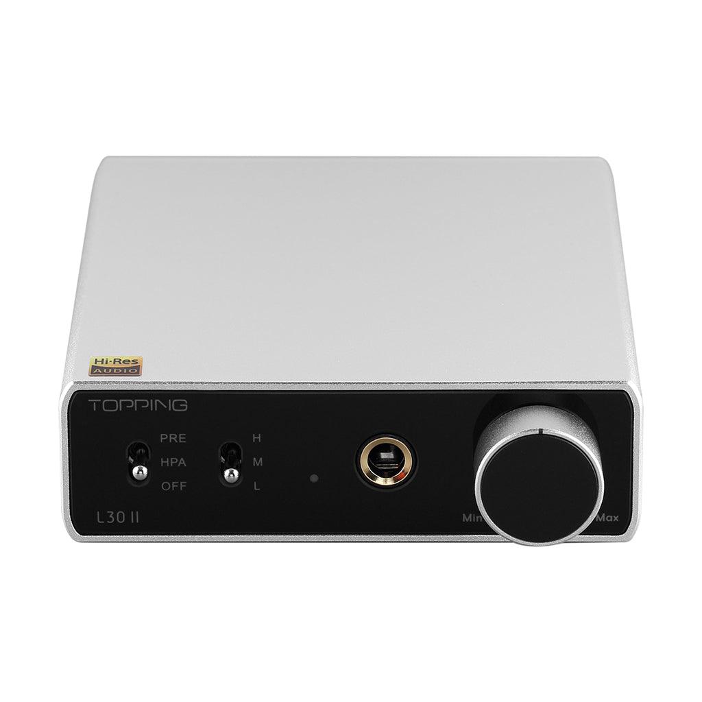 The Topping L30 II by Topping is a silver headphone amplifier with a black front panel, volume knob, headphone jack, switches, and a Hi-Res Audio sticker. It uses an advanced NFCA module to deliver superior sound quality.