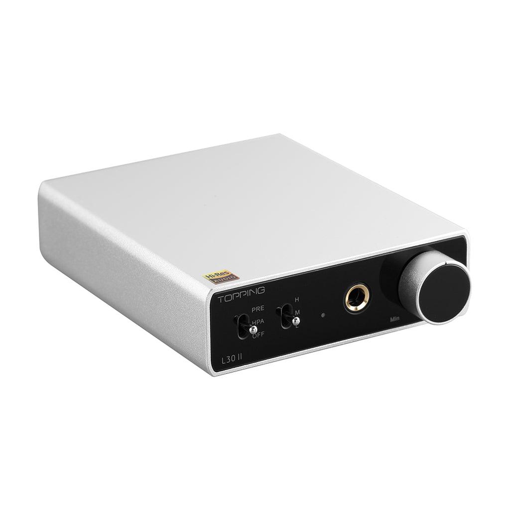 The Topping L30 II by Topping is a compact silver and black headphone amplifier with a large volume knob, front-panel input/output jacks and switches, and an advanced NFCA module for high-fidelity audio.