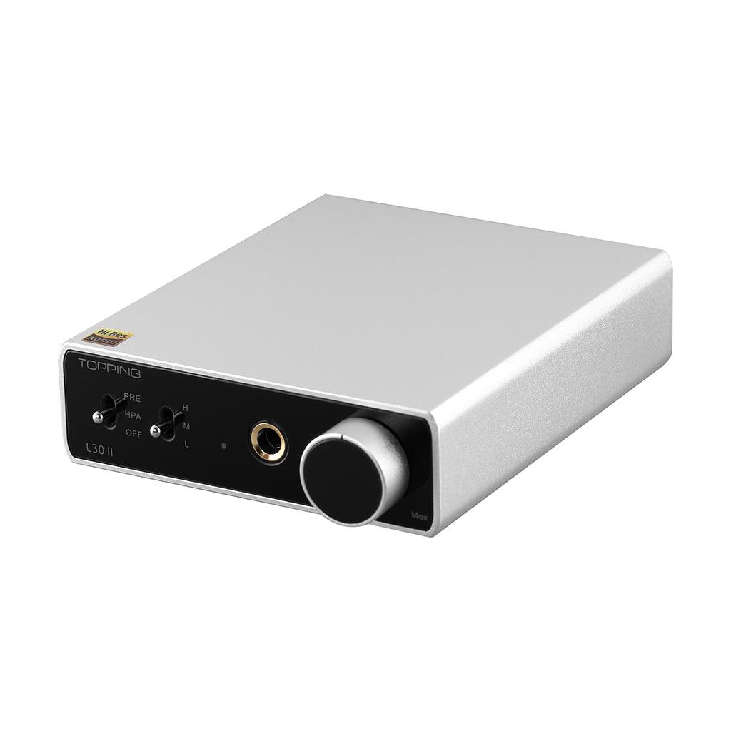 The Topping L30 II headphone amplifier by Topping features a silver body, black front panel with input switches, headphone jack, and large volume knob, powered by an advanced NFCA module and displayed on a white background.