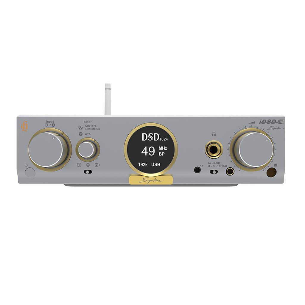 Front view of the silver iFi Audio Pro iDSD Signature DAC/Amp & Streamer by iFi Audio, featuring gold accents, a circular display showing DSD 49 MHz, and an array of knobs, buttons, and input/output ports on its front panel.