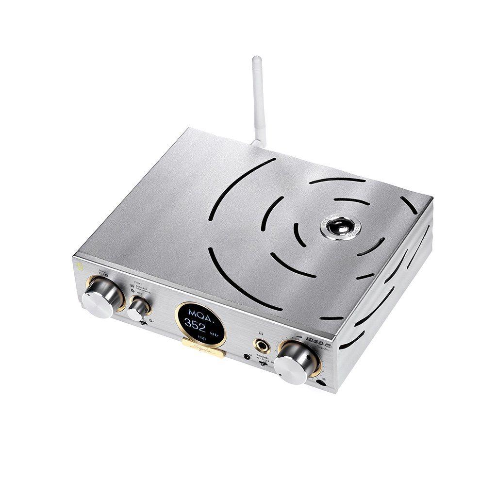 The iFi Audio Pro iDSD Signature DAC/Amp & Streamer by iFi Audio features a sleek silver finish, round display, knobs, buttons, headphone jack, front-panel DAC controls, and a rear vertical antenna for streaming—all set against a white background.