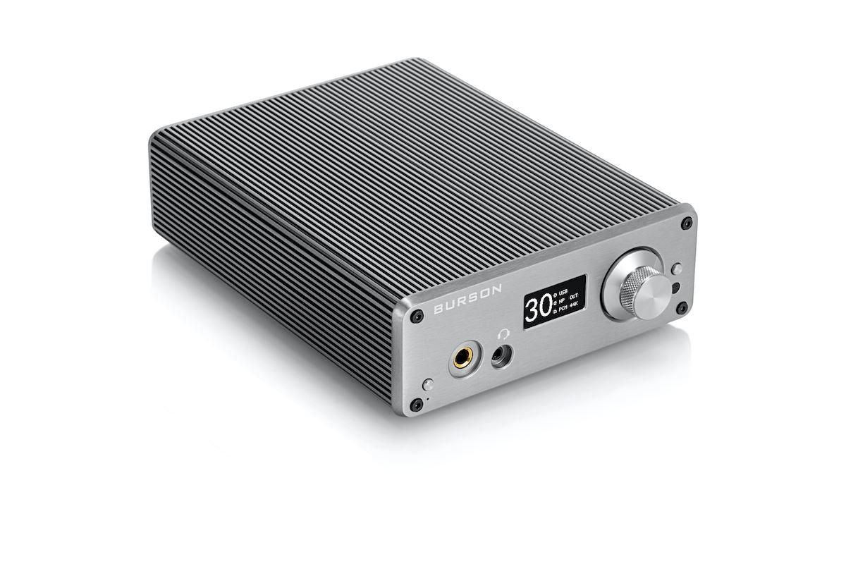A Burson Audio Playmate 2 Class-A amplifier by Burson Audio, featuring a ribbed silver casing, volume knob, headphone jack, DAC, digital display at 30, and control buttons, is shown against a white background.