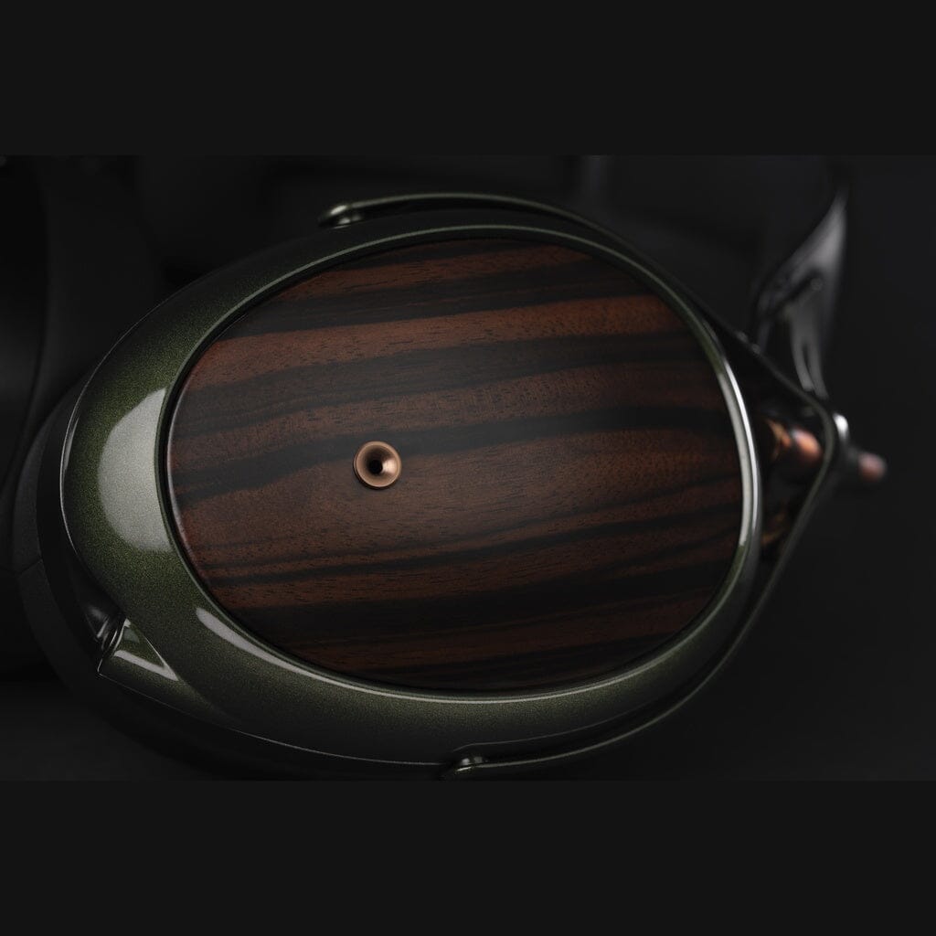 Close-up of a Meze Audio Strada Headphones earcup, featuring a glossy dark green rim and brown-black striped wood grain panel with a metallic screw—crafted by Meze for exceptional tonal balance.