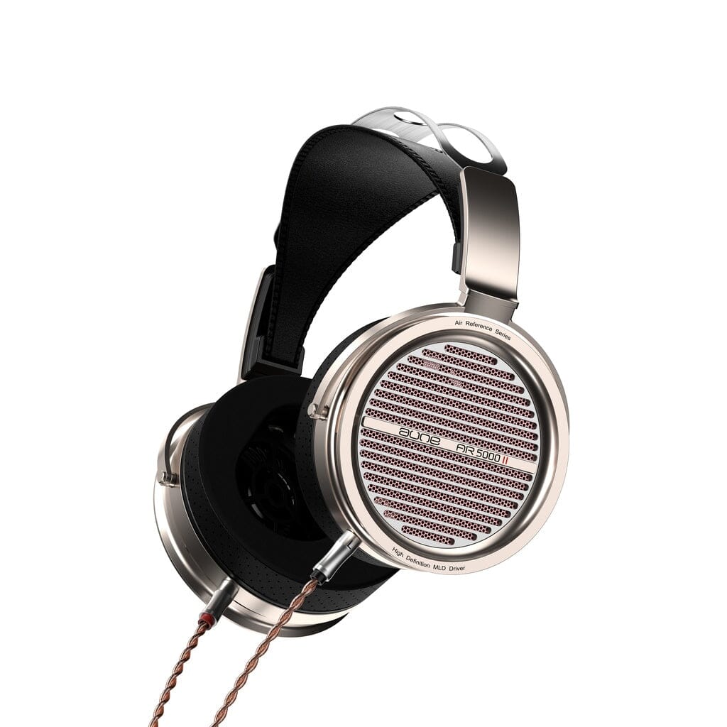 The Aune AR5000 MK2 Headphones from Aune Audio are high-end, over-ear headphones featuring a striking silver and black design with large circular ear cups, a padded headband, and a distinctive brown braided cable attached to the left earcup. Powered by a 50mm MLD dynamic driver, these open-back dynamic headphones deliver naturally spacious sound for an immersive listening experience.