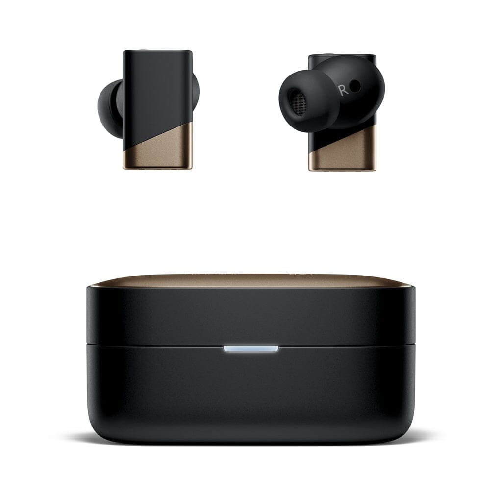 The Status Audio Pro X True Wireless - GoldenSound Edition earbuds in black and gold are pictured resting above the matching GoldenSound Edition charging case, which features a small front-facing LED light, all set against a plain white background. These limited-edition IEMs from Status Audio blend premium style with state-of-the-art technology.