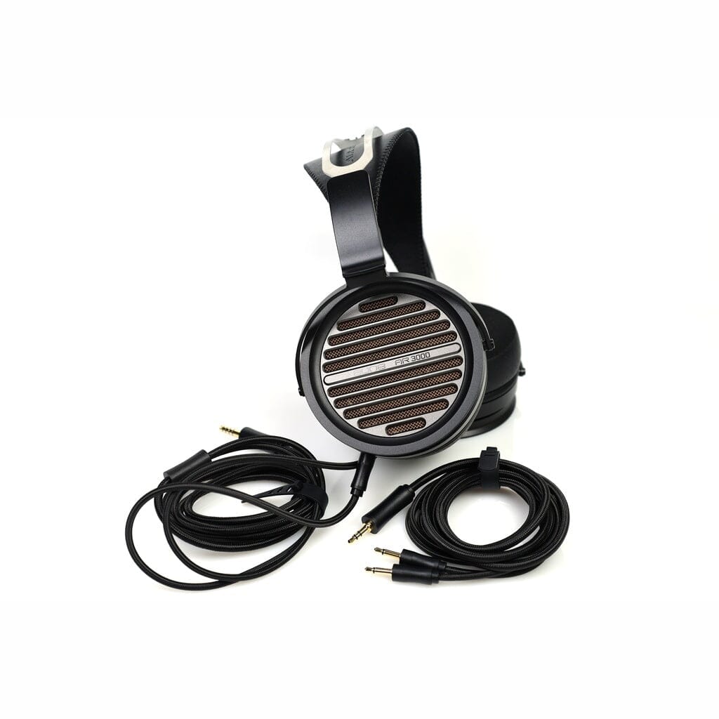 Aune Audio AR3000 over-ear open-back headphones with a striped grille and two black cables with auxiliary jacks.