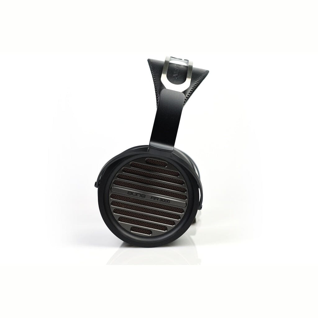 Black Aune Audio AR3000 over-ear headphones with a slatted circular ear cup and a flexible leather-like suspension headband, available in the US.
