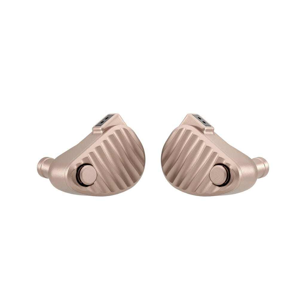 A pair of 64 Audio Ocean In-Ear Headphones by 64 Audio, featuring a metallic beige finish with a ribbed texture and distinctive round accents near the base inspired by hybrid driver design, are positioned facing each other on a white background.