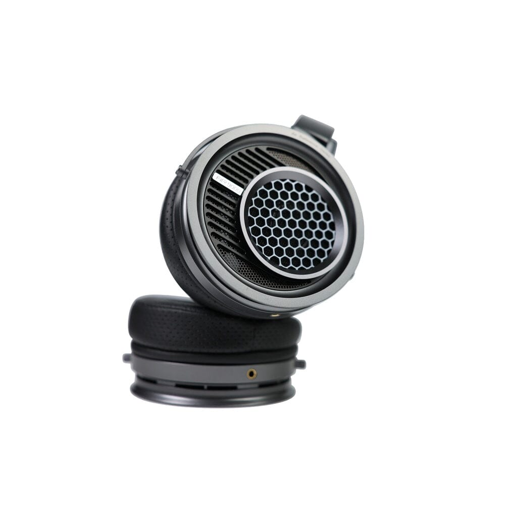 A close-up of the Aune Audio Aune AR9000 Headphones, featuring an open-back design with a honeycomb grill on the ear cup, displayed against a white background.