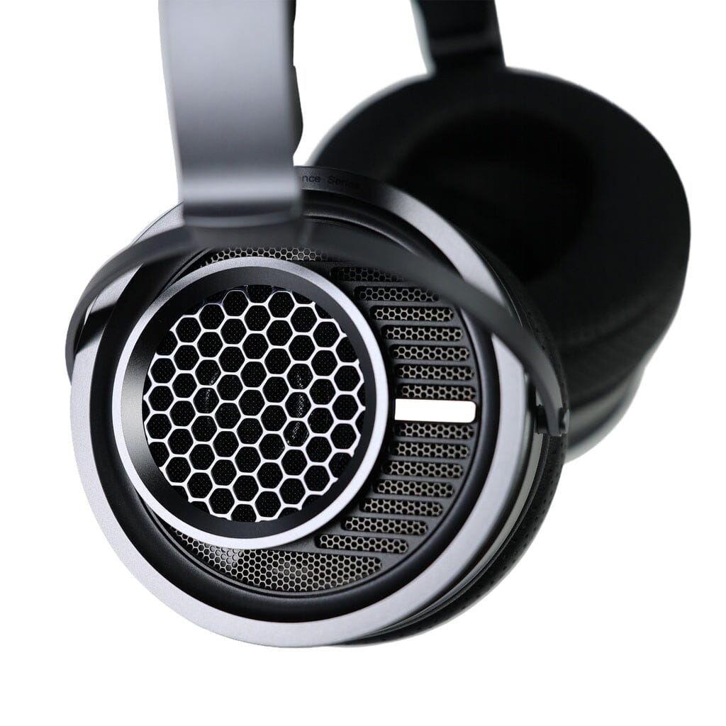 Close-up of the Aune AR9000 Headphones by Aune Audio, showcasing a black and silver over-ear design with an open-back honeycomb-style grille and mesh ear cup, displayed on a white background.