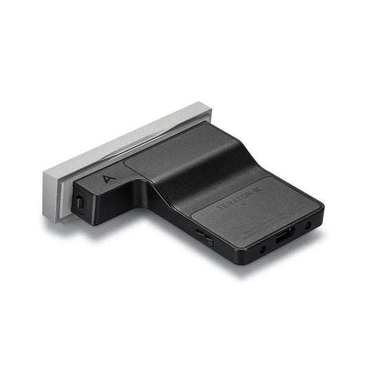 A black rectangular Astell & Kern SEM2 All-In One Module for SE180 with a silver edge, ports, and buttons appears on a white background—matching the style of the SE180 digital audio player’s interchangeable DAC amplifier module.