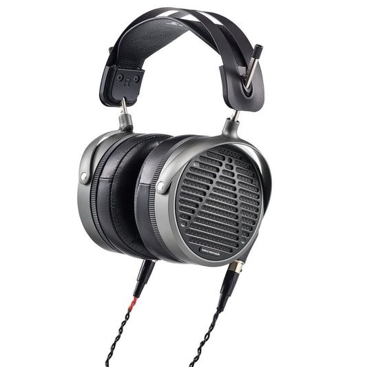 The Audeze MM-520 Headphones feature large rectangular ear cups with a grille design, thick padded cushions, a wide cushioned headband, and planar magnetic drivers for exceptional audio via a braided cable on the left cup.