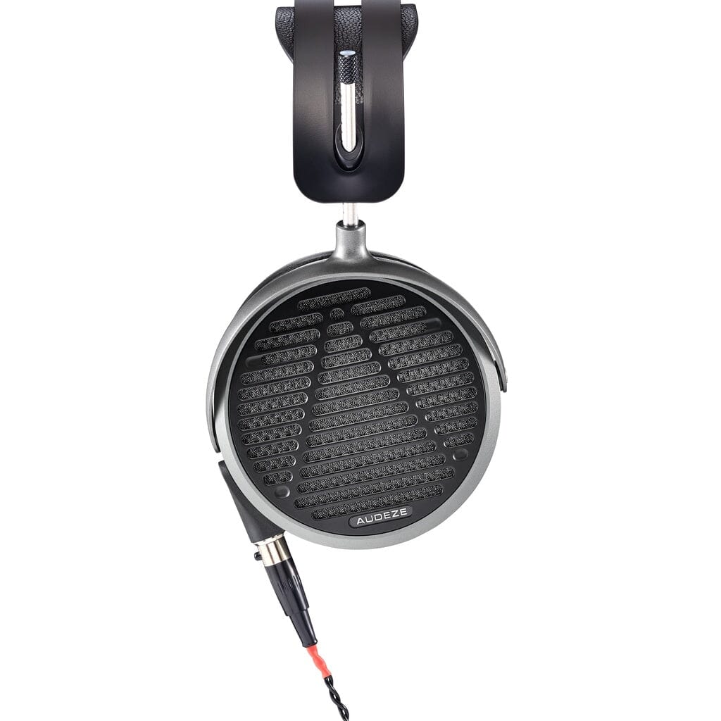 Close-up of a single Audeze MM-520 headphone, featuring planar magnetic drivers, a mesh grille, circular ear cup, and detachable cable. The Audeze branding and MM-520 model name are visible on the ear cup.