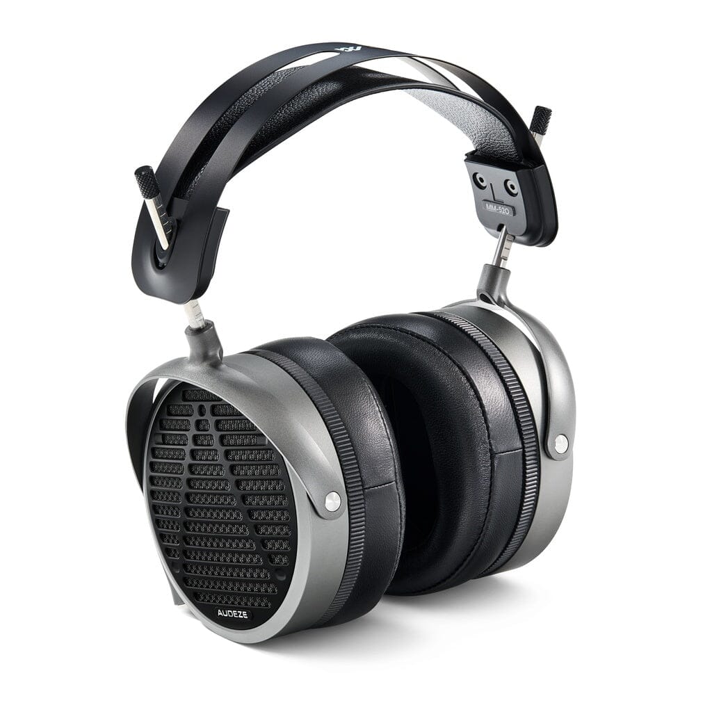 The Audeze MM-520 Headphones feature large oval ear cups with a grille pattern, planar magnetic drivers, cushioned black ear pads, and a durable metal headband for an industrial design.