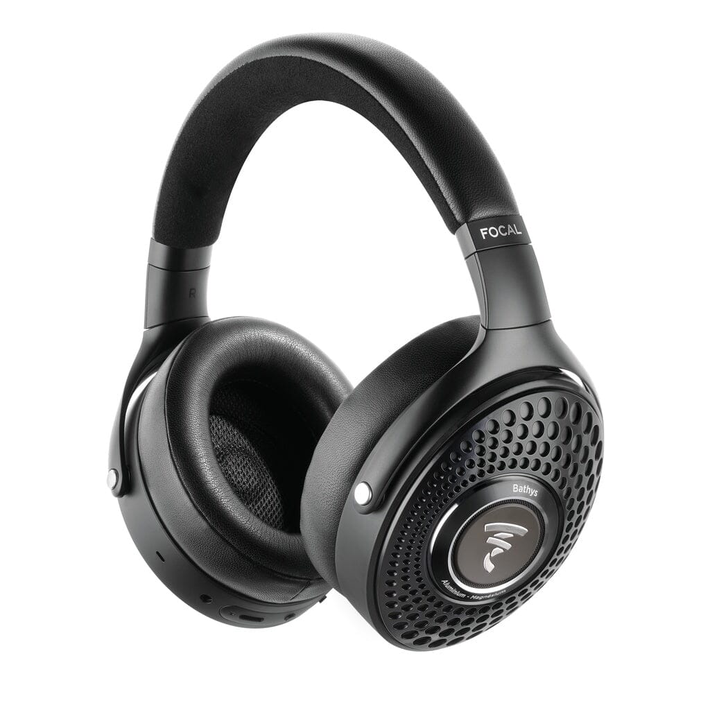 The Focal Bathys are black, over-ear wireless noise-canceling headphones featuring a padded headband, perforated earcups, and distinctive Focal Bathys branding. The right earcup displays a textured pattern with a circular Focal logo at its center. Customizable EQ settings let you tailor your listening experience to your preferences.