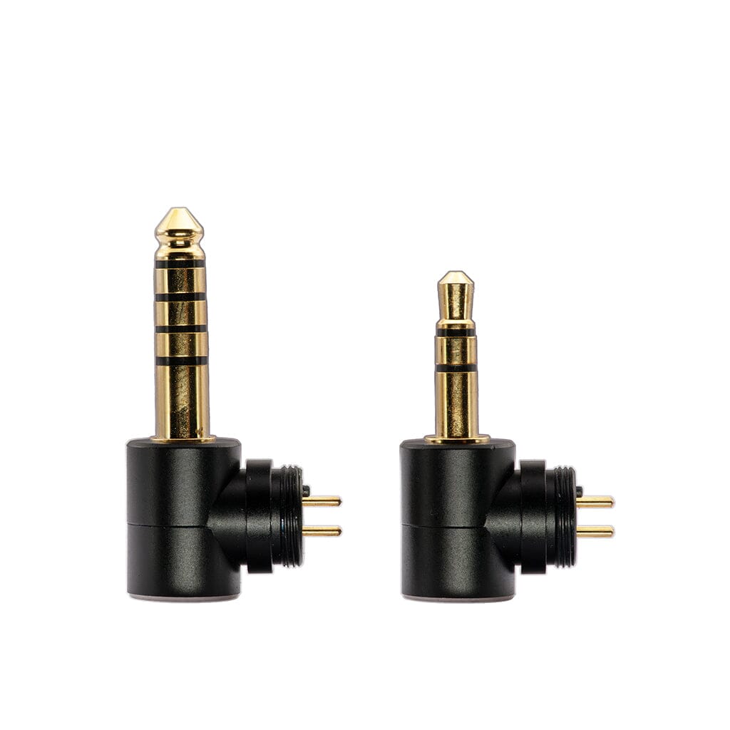 Crinear Daybreak In-Ear Headphones by Crinear are shown side by side; both have gold contacts, cylindrical black bases, and right-angle plugs with a black and gold finish for audiophile-grade sound quality. One is larger than the other.
