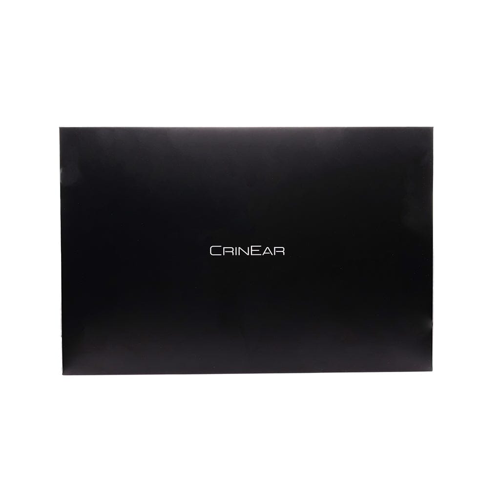 A plain black rectangular box with “CRINEAR” in white, centered on the front, serves as the packaging for Crinear Daybreak In-Ear Headphones by Crinear. Background is white.
