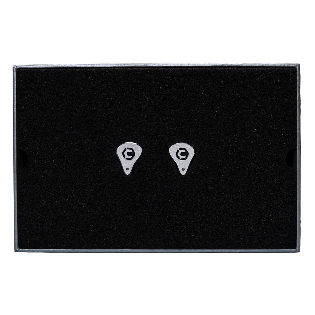 A pair of small, silver, gear-shaped CrinEar Reference In-Ear Headphones by CrinEar with a black E logo are centered on black foam inside a rectangular box.