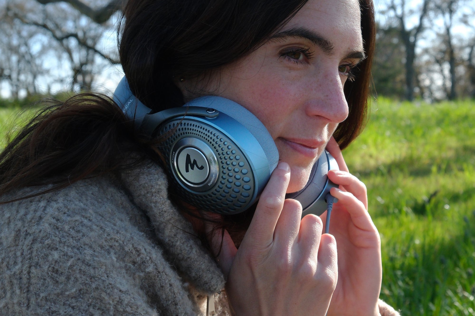 Focal Azurys Closed-Back Wired Dynamic Headphones on woman's neck outside Lifestyle - Headphones.com